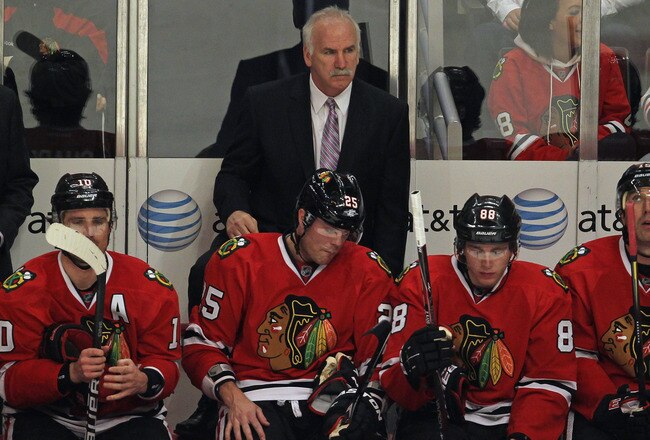 CHICAGO, IL - FEBRUARY 21: Head coach Joel Quenneville of the Chicago Blackhawks watches as his team takes on the Detroit Red Wings at the United Center on February 21, 2012 in Chicago, Illinois.  The Blackhawks defeated the Red Wings 2-1. (Photo by Jonathan Daniel/Getty Images)