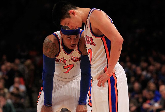 NEW YORK, NY - FEBRUARY 20: Carmelo Anthony #7 and Jeremy Lin #17 of the New York Knicks stand on the court against the New Jersey Nets at Madison Square Garden on February 20, 2012 in New York City. NOTE TO USER: User expressly acknowledges and agrees that, by downloading and/or using this Photograph, user is consenting to the terms and conditions of the Getty Images License Agreement.  (Photo by Chris Trotman/Getty Images)