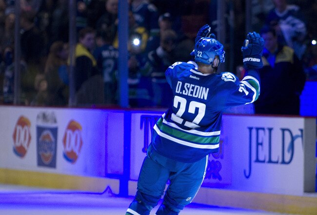 VANCOUVER, CANADA - FEBRUARY 18: Daniel Sedin #22 of the Vancouver Canucks salutes the crowd after being name the game's first star after defeating the Toronto Maple Leafs 6-1in NHL action on February 18, 2012 at Rogers Arena in Vancouver, British Columbia, Canada.  (Photo by Rich Lam/Getty Images)