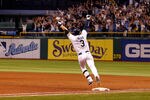 ST PETERSBURG, FL - SEPTEMBER 28:  Infielder Evan Longoria #3 of the Tampa Bay Rays rounds the bases after his bottom of the twelveth inning walk off home run against the New York Yankees during the game at Tropicana Field on September 28, 2011 in St. Petersburg, Florida.  (Photo by J. Meric/Getty Images)