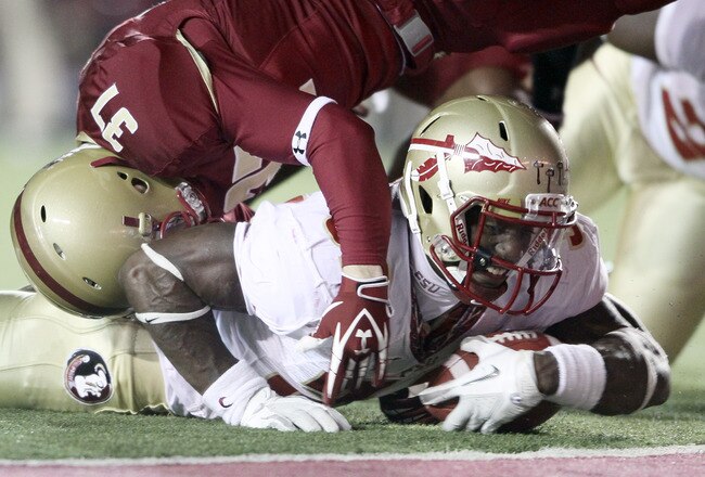 CHESTNUT HILL, MA - NOVEMBER 03:  James Wilder Jr. #32 of the Florida State Seminoles is stopped short of a touchdown by Hampton Hughes #37 of the Boston College Eagles on November 3, 2011 at Alumni Stadium in Chestnut Hill, Massachusetts.  (Photo by Elsa/Getty Images)