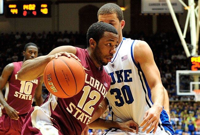DURHAM, NC - JANUARY 21:  Jeff Peterson #12 of the Florida State Seminoles drives the baseline as Seth Curry #30 of the Duke Blue Devils defends during play at Cameron Indoor Stadium on January 21, 2012 in Durham, North Carolina. Florida State won 76-73 to end Duke's 44-game home winning streak.  (Photo by Grant Halverson/Getty Images)