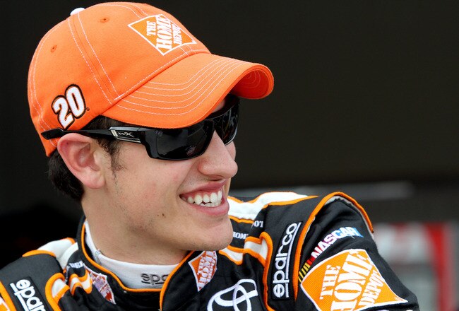 DAYTONA BEACH, FL - FEBRUARY 22:  Joey Logano, driver of the #20 The Home Depot Toyota, looks on in the garage during practice for the NASCAR Sprint Cup Series Daytona 500 at Daytona International Speedway on February 22, 2012 in Daytona Beach, Florida.  (Photo by Jerry Markland/Getty Images for NASCAR)