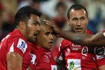 BRISBANE, AUSTRALIA - JULY 09:  Digby Ioane and Quade Cooper of the Reds congratulate team mate Will Genia (C) after scoring a try during the 2011 Super Rugby Grand Final match between the Reds and the Crusaders at Suncorp Stadium on July 9, 2011 in Brisbane, Australia.  (Photo by Cameron Spencer/Getty Images)