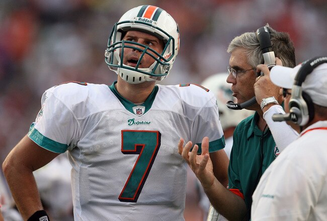 MIAMI - DECEMBER 06:  Quarterback Chad Henne #7 of the Miami Dolphins talks with offensive coordinator Dan Henning and head coach Tony Sparano late in the game against the New England Patriots at Land Shark Stadium on December 6, 2009 in Miami, Florida. The Dolphins defeated the Patriots 22-21.  (Photo by Doug Benc/Getty Images)
