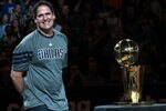 DALLAS, TX - DECEMBER 25:  Owner Mark Cuban of the Dallas Mavericks stands with the NBA trophy before a game against the Miami Heat on opening day of the NBA season at American Airlines Center on December 25, 2011 in Dallas, Texas.  NOTE TO USER: User expressly acknowledges and agrees that, by downloading and/or using this Photograph, user is consenting to the terms and conditions of the Getty Images License Agreement.  (Photo by Ronald Martinez/Getty Images)