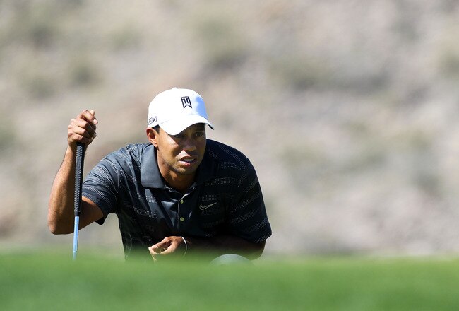 MARANA, AZ - FEBRUARY 23:  Tiger Woods lines up a putt on the ninth hole during the second round of the World Golf Championships-Accenture Match Play Championship at the Ritz-Carlton Golf Club  on February 23, 2012 in Marana, Arizona.  (Photo by Sam Greenwood/Getty Images)