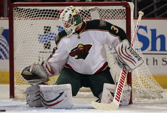 CHICAGO, IL - JANUARY 12:  Josh Harding #37 of the Minnesota Wild makes a save against the Chicago Blackhawks at the United Center on January 12, 2012 in Chicago, Illinois. The Blackhawks defeated the Wild 5-2.  (Photo by Jonathan Daniel/Getty Images)