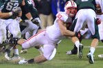 EAST LANSING, MI - OCTOBER 22:  Ethan Hemer #87 of the Wisconsin Badgers sacks Kirk Cousins #8 of the Michigan State Spartans in the fourth quarter of the game at Spartan Stadium on October 22, 2011 in East Lansing, Michigan. The Spartans defeated the Badgers 37-31 on the final play of the game.  (Photo by Mark Cunningham/Getty Images)