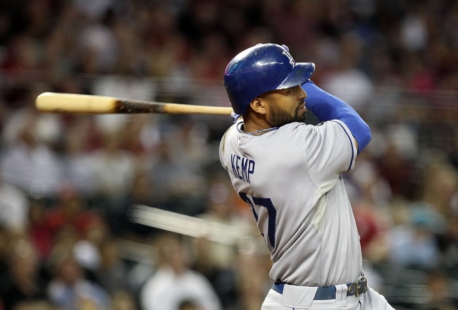 PHOENIX, AZ - SEPTEMBER 27:  Matt Kemp #27 of the Los Angeles Dodgers hits a double against the Arizona Diamondbacks during the fourth inning of the Major League Baseball game at Chase Field on September 27, 2011 in Phoenix, Arizona.  (Photo by Christian Petersen/Getty Images)