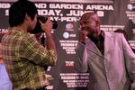 BEVERLY HILLS, CA - FEBRUARY 21:  Manny Pacquiao (L) uses a photographer's camera to take a shot of Timothy Bradley at a press conference announcing their upcoming World Boxing Organization welterweight championship fight at The Beverly Hills Hotel on February 21, 2012 in Beverly Hills, California.  (Photo by Stephen Dunn/Getty Images)