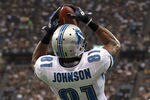 NEW ORLEANS, LA - JANUARY 07:  Calvin Johnson #81 of the Detroit Lions catches a pass for a touchdown in the second quarter against the New Orleans Saints during their 2012 NFC Wild Card Playoff game at Mercedes-Benz Superdome on January 7, 2012 in New Orleans, Louisiana.  (Photo by Ronald Martinez/Getty Images)