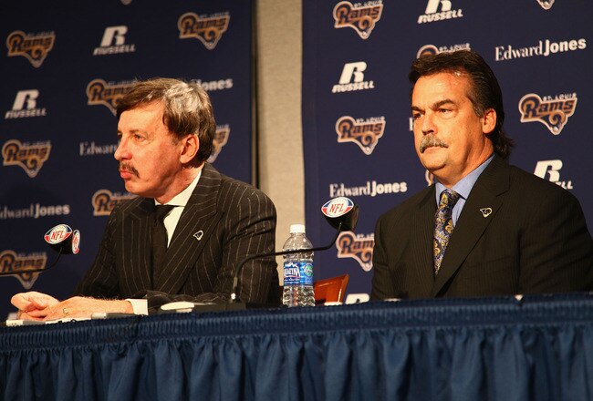 EARTH CITY, MO - JANUARY 17: St. Louis Rams owner Stanl Kroenke (left) and newly announced head coach Jeff Fisher during a press conference to introduce Fisher at the Russell Training Center on January 17, 2012 in Earth City, Missouri.  (Photo by Dilip Vishwanat/Getty Images)