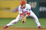 PHILADELPHIA, PA - OCTOBER 07:  Chase Utley #26 of the Philadelphia Phillies fields the ball against the St. Louis Cardinals during Game Five of the National League Divisional Series at Citizens Bank Park on October 7, 2011 in Philadelphia, Pennsylvania.  (Photo by Drew Hallowell/Getty Images)
