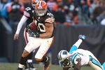 CLEVELAND - NOVEMBER 28:  Running back Peyton Hillis #40 of the Cleveland Browns runs the ball by linebacker Jon Beason #52 of the Carolina Panthers at Cleveland Browns Stadium on November 28, 2010 in Cleveland, Ohio.  (Photo by Matt Sullivan/Getty Images)