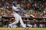 PHOENIX, AZ - SEPTEMBER 28:  Matt Kemp #27 of the Los Angeles Dodgers hits a two run home run against the Arizona Diamondbacks during the seventh inning of the Major League Baseball game at Chase Field on September 28, 2011 in Phoenix, Arizona.  (Photo by Christian Petersen/Getty Images)