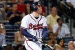 ATLANTA, GA - SEPTEMBER 12:  Freddie Freeman #5 of the Atlanta Braves hits a deep pop fly that scores Michael Bourn #24 in the fifth inning against the Florida Marlins at Turner Field on September 12, 2011 in Atlanta, Georgia.  (Photo by Kevin C. Cox/Getty Images)