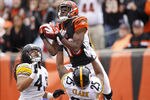 CINCINNATI, OH - NOVEMBER 13: A.J. Green #18 of the Cincinnati Bengals makes a 36-yard touchdown reception in the first quarter over Ryan Clark #25 and Troy Polamalu #43 of the Pittsburgh Steelers at Paul Brown Stadium on November 13, 2011 in Cincinnati, Ohio. (Photo by Joe Robbins/Getty Images)