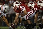 MADISON, WI - OCTOBER 16: Peter Konz #66 of the Wisconsin Badgers prepares to snap the ball to Scott Tolzien #16 against the Ohio State Buckeyes at Camp Randall Stadium on October 16, 2010 in Madison, Wisconsin. Wisconsin defeated Ohio State 31-18.  (Photo by Jonathan Daniel/Getty Images)