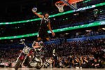 ORLANDO, FL - FEBRUARY 25:  Derrick Williams of the Minnesota Timberwolves jumps over a motorcycle as he dunks during the Sprite Slam Dunk Contest part of 2012 NBA All-Star Weekend at Amway Center on February 25, 2012 in Orlando, Florida.  NOTE TO USER: User expressly acknowledges and agrees that, by downloading and or using this photograph, User is consenting to the terms and conditions of the Getty Images License Agreement.  (Photo by Mike Ehrmann/Getty Images)