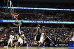 WASHINGTON - MARCH 17:  J.P. Primm #3 of the North Carolina-Asheville Bulldogs puts in a layup against the Pittsburgh Panthers during the second round of the 2011 NCAA men's basketball tournament at the Verizon Center on March 17, 2011 in Washington, DC.  (Photo by Nick Laham/Getty Images)