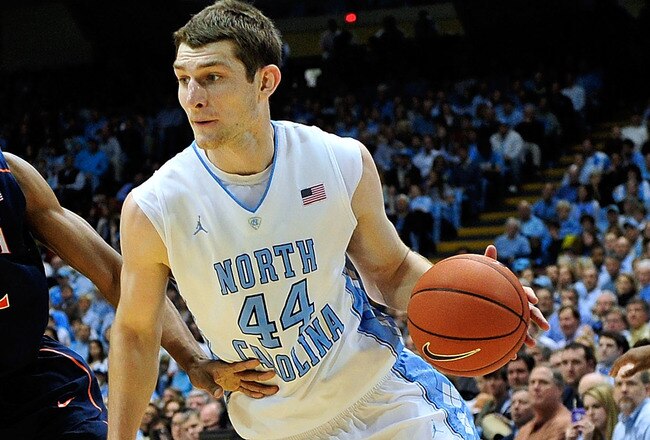 CHAPEL HILL, NC - FEBRUARY 11:  Tyler Zeller #44 of the North Carolina Tar Heels drives the baseline against defender Darion Atkins #32 of the Virginia Cavaliers during play at the Dean Smith Center on February 11, 2012 in Chapel Hill, North Carolina. North Carolina won 70-52.  (Photo by Grant Halverson/Getty Images)