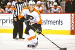 WINNIPEG, MB - FEBRUARY 21: Matt Carle #25 of the Philadelphia Flyers controls the puck on the power play during their NHL game against the Winnipeg Jets at MTS Centre on February 21, 2012 in Winnipeg, Manitoba, Canada. (Photo by Tom Szczerbowski/Getty Images)