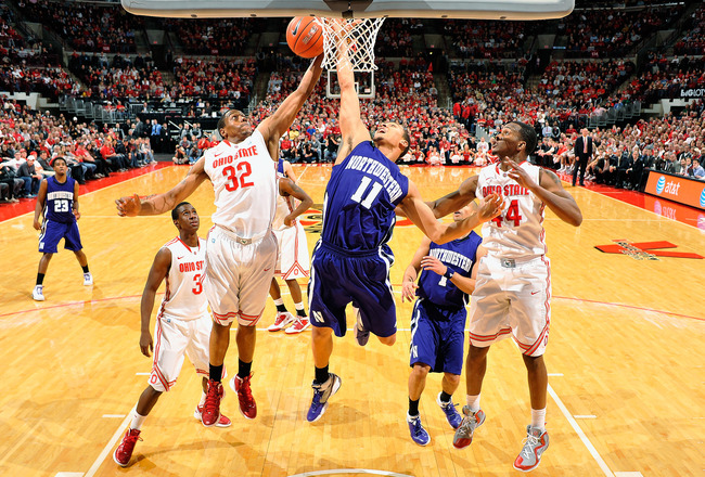 COLUMBUS, OH - DECEMBER 28:  Lenzelle Smith, Jr. #32 of the Ohio State Buckeyes grabs a round ahead of Reggie Hearn #11 of the Northwestern Wildcats on December 28, 2011 at Value City Arena in Columbus, Ohio. Ohio State defeated Northwestern 87-54.   (Photo by Jamie Sabau/Getty Images)