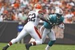 CLEVELAND, OH - SEPTEMBER 25:  Wide receiver Davone Bess #15 of the Miami Dolphins runs by linebacker D'Qwell Jackson #52 of the Cleveland Browns at Cleveland Browns Stadium on September 25, 2011 in Cleveland, Ohio.  (Photo by Matt Sullivan/Getty Images)