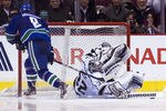 VANCOUVER, CANADA - JANUARY 17: Goalie Jonathan Quick #32 of the Los Angeles Kings stops the shootout attempt of Cody Hodgson #9 of the Vancouver Canucks during the shootout in NHL action on January 17, 2012 at Rogers Arena in Vancouver, British Columbia, Canada.  (Photo by Rich Lam/Getty Images)
