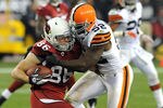 GLENDALE, AZ - DECEMBER 18:  D'Qwell Jackson #52 of the Cleveland Browns tackles Todd Heap #86 of the Arizona Cardinals at University of Phoenix Stadium on December 18, 2011 in Glendale, Arizona. Arizona won 20-17.   (Photo by Norm Hall/Getty Images)