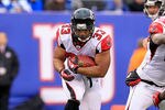 EAST RUTHERFORD, NJ - JANUARY 08:  Michael Turner #33 of the Atlanta Falcons runs the ball against the New York Giants during their NFC Wild Card Playoff game at MetLife Stadium on January 8, 2012 in East Rutherford, New Jersey.  (Photo by Chris Trotman/Getty Images)