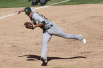 ARLINGTON, TX - SEPTEMBER 11: Scott Sizemore #29 of the Oakland Athletics fields an infield hit against the Texas Rangers at Rangers Ballpark in Arlington on September 11, 2011 in Arlington, Texas. (Photo by Rick Yeatts/Getty Images)