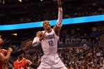 ORLANDO, FL - FEBRUARY 06:  Dwight Howard #12 of the Orlando Magic attempts a shot during the game against the Los Angeles Clippers at Amway Center on February 6, 2012 in Orlando, Florida.   NOTE TO USER: User expressly acknowledges and agrees that, by downloading and or using this Photograph, user is consenting to the terms and conditions of the Getty Images License Agreement.  (Photo by Sam Greenwood/Getty Images)