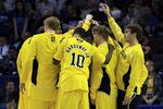 CHARLOTTE, NC - MARCH 20:  The Michigan Wolverines huddle before taking on the Duke Blue Devils during the third round of the 2011 NCAA men's basketball tournament at Time Warner Cable Arena on March 20, 2011 in Charlotte, North Carolina.  (Photo by Streeter Lecka/Getty Images)