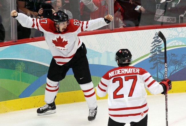 VANCOUVER, BC - FEBRUARY 28:  Sidney Crosby (L) #87 of Canada celebrates with teammate Scott Niedermayer #27 after scoring the matchwinning goal in overtime during the ice hockey men's gold medal game between USA and Canada on day 17 of the Vancouver 2010 Winter Olympics at Canada Hockey Place on February 28, 2010 in Vancouver, Canada.  (Photo by Alex Livesey/Getty Images)