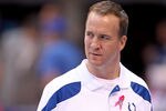 INDIANAPOLIS, IN - OCTOBER 09:  Peyton Manning of the Indianapolis Colts watches his team warm up before the NFL game against the Kansas City Chiefs at Lucas Oil Stadium on October 9, 2011 in Indianapolis, Indiana.  (Photo by Andy Lyons/Getty Images)