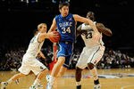 NEW YORK, NY - NOVEMBER 15:  Ryan Kelly #34 of the Duke Blue Devils drives the ball against Austin Thornton #13 and Draymond Green #23 of the Michigan State Spartans during the 2011 State Farm Champions Classic at Madison Square Garden on November 15, 2011 in New York City.  (Photo by Patrick McDermott/Getty Images)