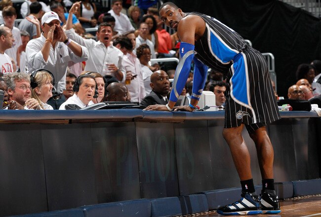 ATLANTA, GA - APRIL 28:  Dwight Howard #12 of the Orlando Magic stands at the scorer's table after being earning a technical foul against Zaza Pachulia #27 of the Atlanta Hawks during Game Six of the Eastern Conference Quarterfinals in the 2011 NBA Playoffs at Philips Arena on April 28, 2011 in Atlanta, Georgia.  NOTE TO USER: User expressly acknowledges and agrees that, by downloading and or using this photograph, User is consenting to the terms and conditions of the Getty Images License Agreement.  (Photo by Kevin C. Cox/Getty Images)