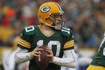 GREEN BAY, WI - JANUARY 01:  Matt Flynn #10 of the Green Bay Packerslooks for a receiver as Ndamukong Suh #90 of the Detroit Lions rushes at Lambeau Field on January 1, 2012 in Green Bay, Wisconsin. The Packers defeated the Lions 45-41.  (Photo by Jonathan Daniel/Getty Images)