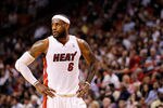 MIAMI, FL - FEBRUARY 21:  LeBron James #6 of the Miami Heat looks on during a game against the Sacramento Kings at American Airlines Arena on February 21, 2012 in Miami, Florida. NOTE TO USER: User expressly acknowledges and agrees that, by downloading and/or using this Photograph, User is consenting to the terms and conditions of the Getty Images License Agreement.  (Photo by Mike Ehrmann/Getty Images)