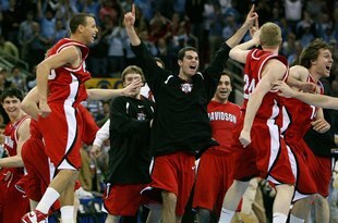 RALEIGH, NC - MARCH 23:  Stephen Curry #30 of the Davidson Wildcats and teammates celebrate after defeating the Georgetown Hoyas during the 2nd round of the East Regional of the 2008 NCAA Men's Basketball Tournament at RBC Center on March 23, 2008 in Raleigh, North Carolina. The Wildcats defeated the Hoyas 74-70. (Photo by Kevin C. Cox/Getty Images)