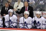 WINNIPEG, CANADA - FEBRUARY 7: Head coach Ron Wilson of the Toronto Maple Leafs questions one of his players from the bench as players David Steckel #20, Joey Crabb #46 and Matthew Lombardi #15 look on during a game against the Winnipeg Jets in NHL action at the MTS Centre on February 7, 2012 in Winnipeg, Manitoba, Canada. (Photo by Marianne Helm/Getty Images)