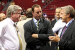 MONTREAL, QC - JUNE 26:  President & General Manager Brian Burke (L) and head coach Ron Wilson (R) of the Toronto Maple Leafs talk with Genral Manager Joe Nieuwendyk of the Dallas Stars prior to the first round of the 2009 NHL Entry Draft at the Bell Centre on June 26, 2009 in Montreal, Quebec, Canada.  (Photo by Bruce Bennett/Getty Images)