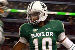ARLINGTON, TX - NOVEMBER 26:  Robert Griffin III #10 of the Baylor Bears celebrates a touchdown against the Texas Tech Red Raiders at Cowboys Stadium on November 26, 2011 in Arlington, Texas.  (Photo by Ronald Martinez/Getty Images)