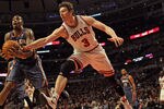 CHICAGO, IL - JANUARY 21:  Omer Asik #3 of the Chicago Bulls and Tyrus Thomas #12 of the Charlotte Bobcats chase down the ball at the United Center on January 21, 2012 in Chicago, Illinois. The Bulls defeated the Bobcats 95-89. NOTE TO USER: User expressly acknowledges and agrees that, by downloading and or using this photograph, User is consenting to the terms and conditions of the Getty Images License Agreement.  (Photo by Jonathan Daniel/Getty Images)