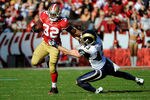 SAN FRANCISCO, CA - DECEMBER 04:  Kendall Hunter #32 of the San Francisco 49ers attempts to break the tackle of Craig Dahl #43 of the St Louis Rams at Candlestick Park on December 4, 2011 in San Francisco, California.  (Photo by Thearon W. Henderson/Getty Images)