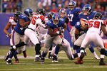 EAST RUTHERFORD, NJ - JANUARY 08:  Brandon Jacobs #27 of the New York Giants runs the ball against the Atlanta Falcons during their NFC Wild Card Playoff game at MetLife Stadium on January 8, 2012 in East Rutherford, New Jersey.  (Photo by Al Bello/Getty Images)