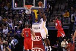 OAKLAND, CA - FEBRUARY 20:  Ekpe Udoh #20 of the Golden State Warriors dunks the ball during their game against the Los Angeles Clippers at Oracle Arena on February 20, 2012 in Oakland, California.  NOTE TO USER: User expressly acknowledges and agrees that, by downloading and or using this photograph, User is consenting to the terms and conditions of the Getty Images License Agreement.  (Photo by Ezra Shaw/Getty Images)