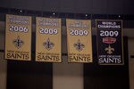 NEW ORLEANS - SEPTEMBER 09:  The banners representing achievements of the New Orleans Saints, including the newly unveiled 2009 Super Bowl World Champions banner, hang above the fans in the upper deck during the Saints game against the Minnesota Vikings at Louisiana Superdome on September 9, 2010 in New Orleans, Louisiana.  (Photo by Chris Graythen/Getty Images)